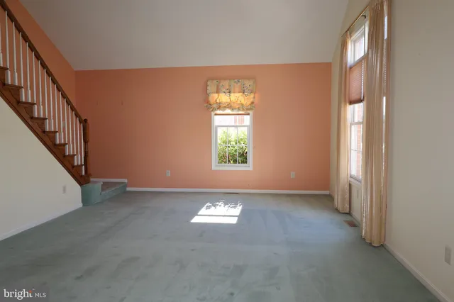 a view of entryway and hall with a window