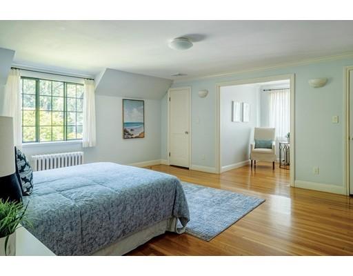20 Metacomet Road Newton, MA 02468 - Photo 12 of 13 a bedroom with a bed a table and wooden floor