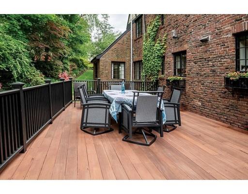 20 Metacomet Road Newton, MA 02468 - Photo 13 of 13 a view of a patio with table and chairs and wooden floor