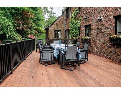 20 Metacomet Road Newton, MA 02468 - Photo 2 of 13 a view of a patio with table and chairs and wooden floor