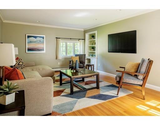20 Metacomet Road Newton, MA 02468 - Photo 7 of 13 a living room with furniture a flat screen tv and a window