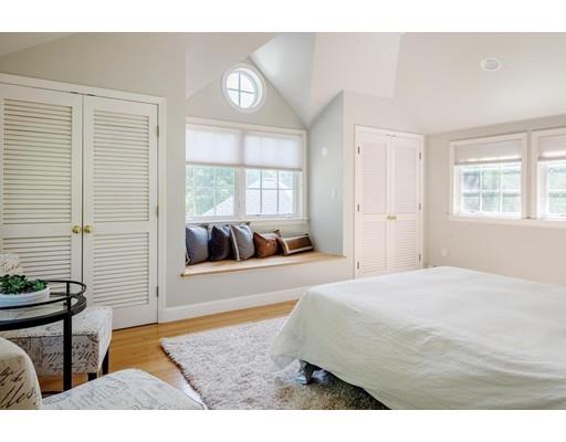 20 Metacomet Road Newton, MA 02468 - Photo 9 of 13 a bedroom with a bed and wooden floor