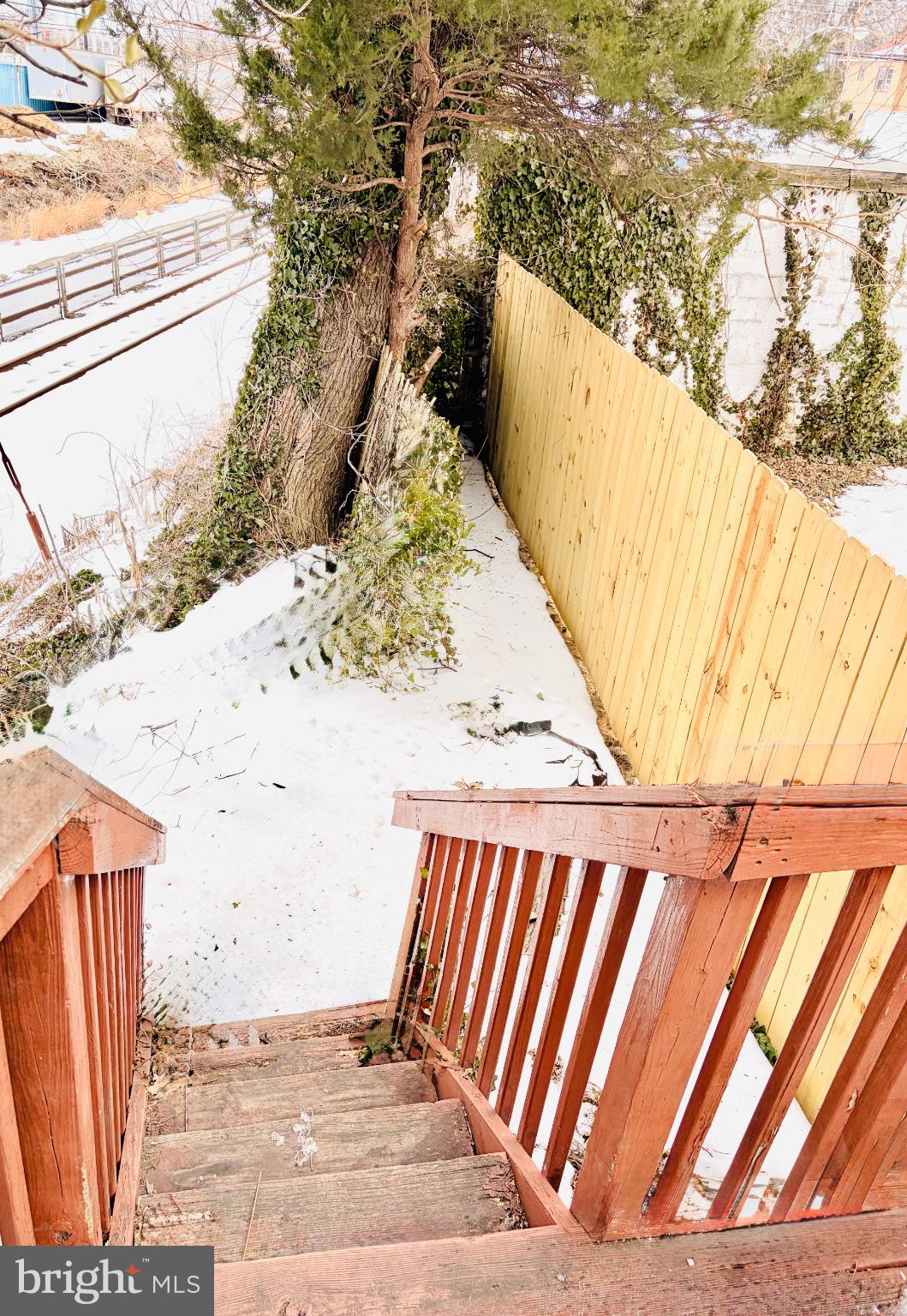 401 Holly Road Yeadon, PA 19050 - Photo 3 of 33 steps off deck, leading to quaint back yard