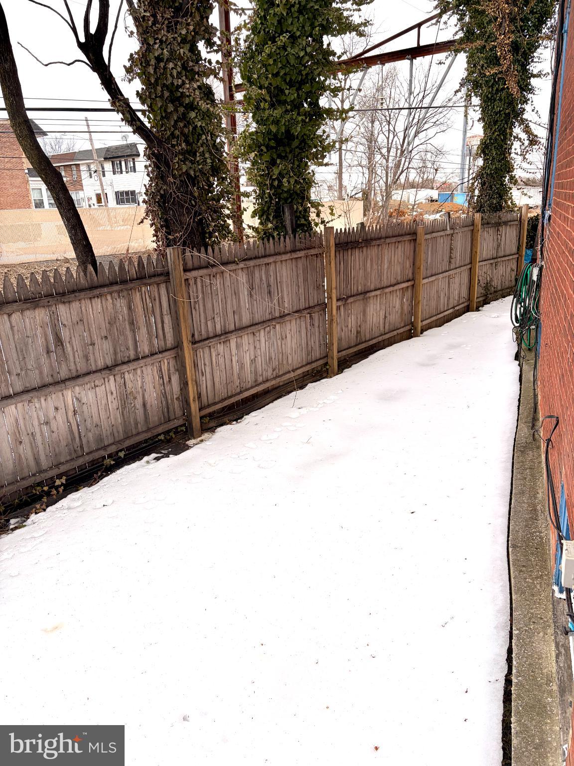 401 Holly Road Yeadon, PA 19050 - Photo 7 of 33 side yard to back deck, from the front yard