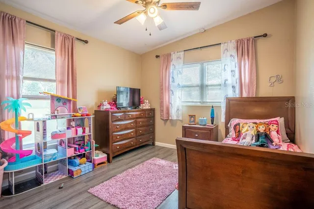 a bedroom with furniture and a window