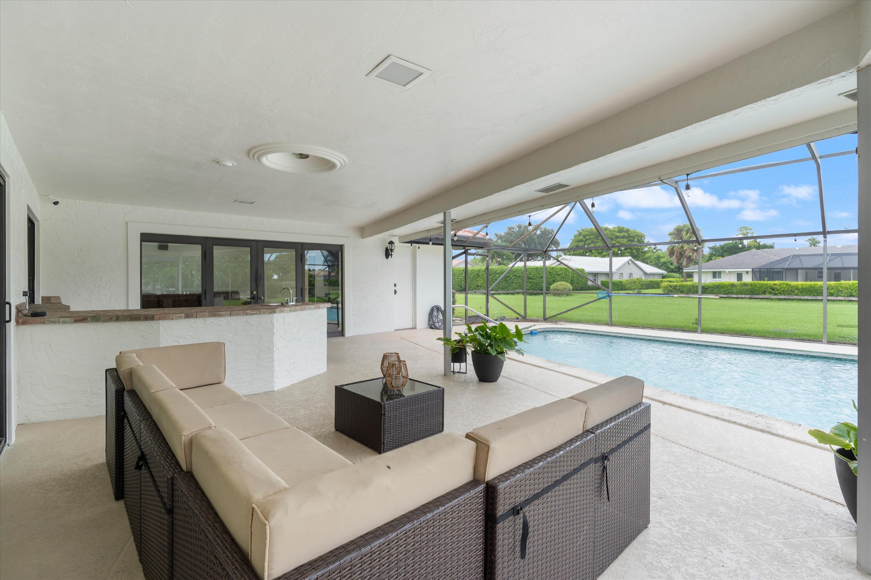 516 Muirfield Drive Atlantis, FL 33462 - Photo 31 of 43 a view of a dining room with furniture window and outside view