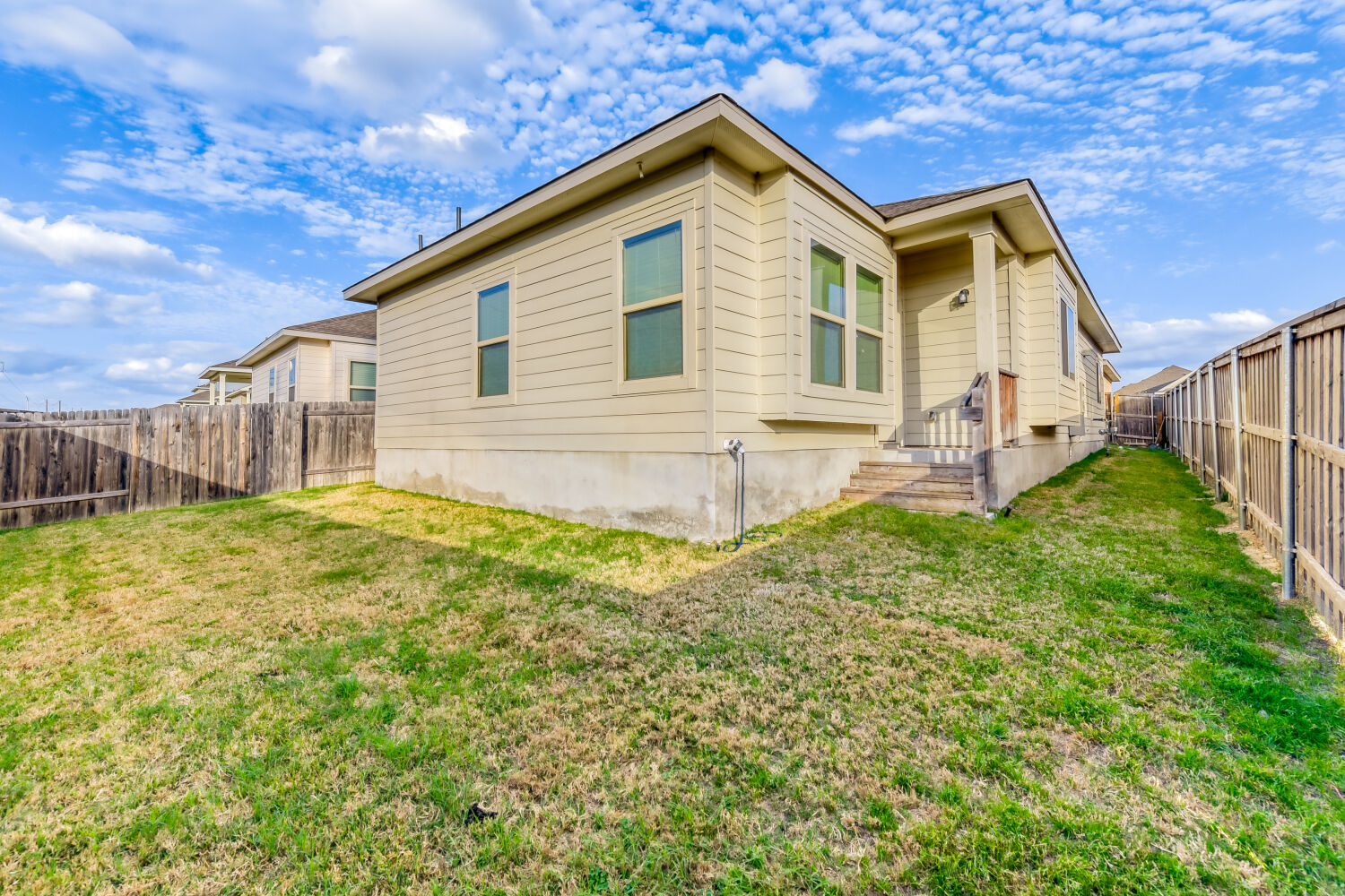 504 Spinnaker Loop Kyle, TX 78640 - Photo 17 of 17 View of side of home with a fenced backyard