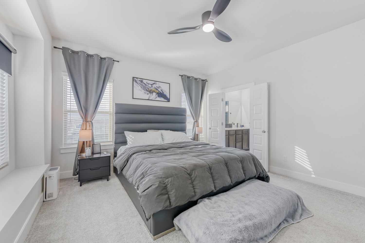 504 Spinnaker Loop Kyle, TX 78640 - Photo 8 of 17 Bedroom featuring light colored carpet, multiple windows, and ceiling fan