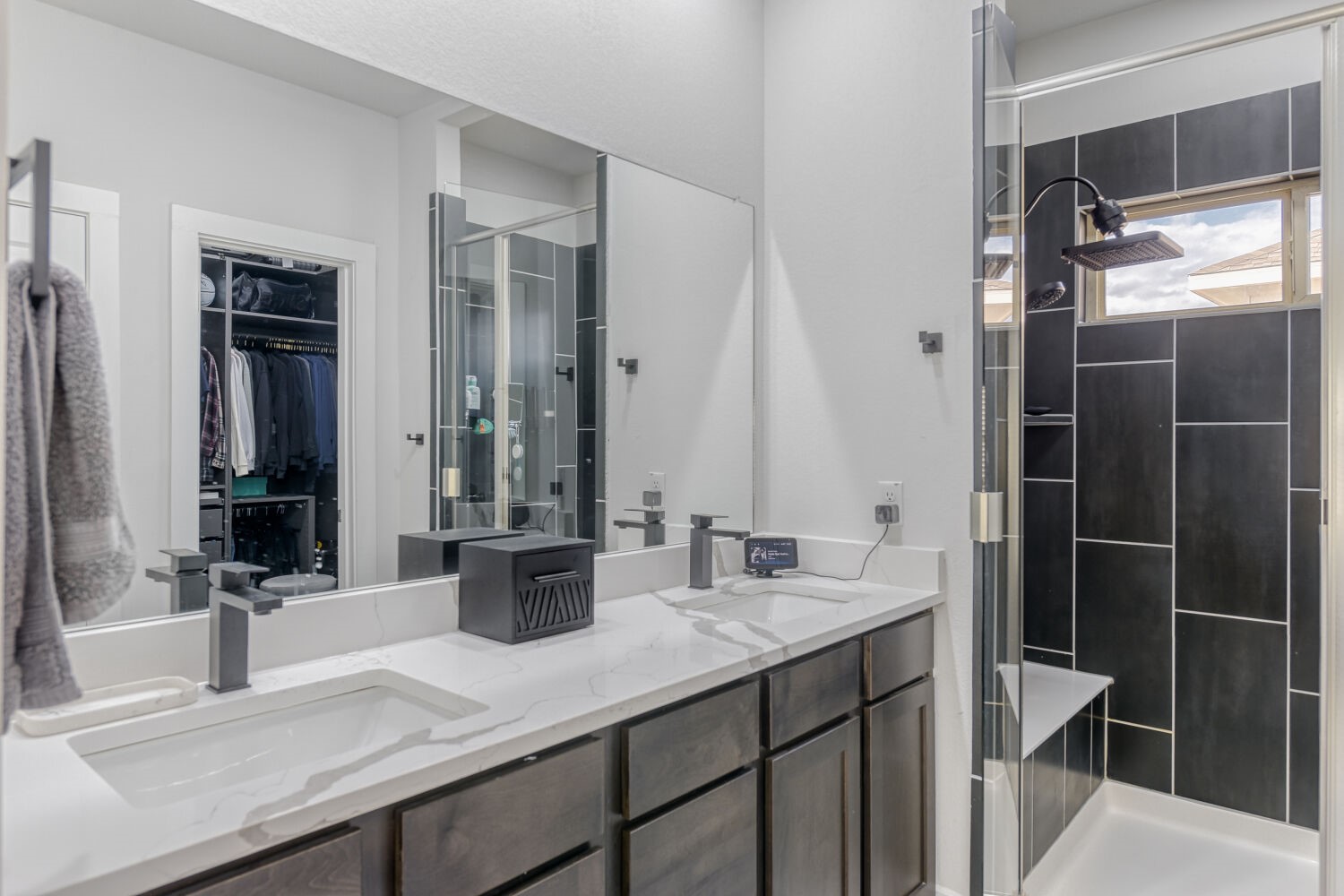 504 Spinnaker Loop Kyle, TX 78640 - Photo 10 of 17 Bathroom featuring a stall shower, double vanity, and a walk in closet
