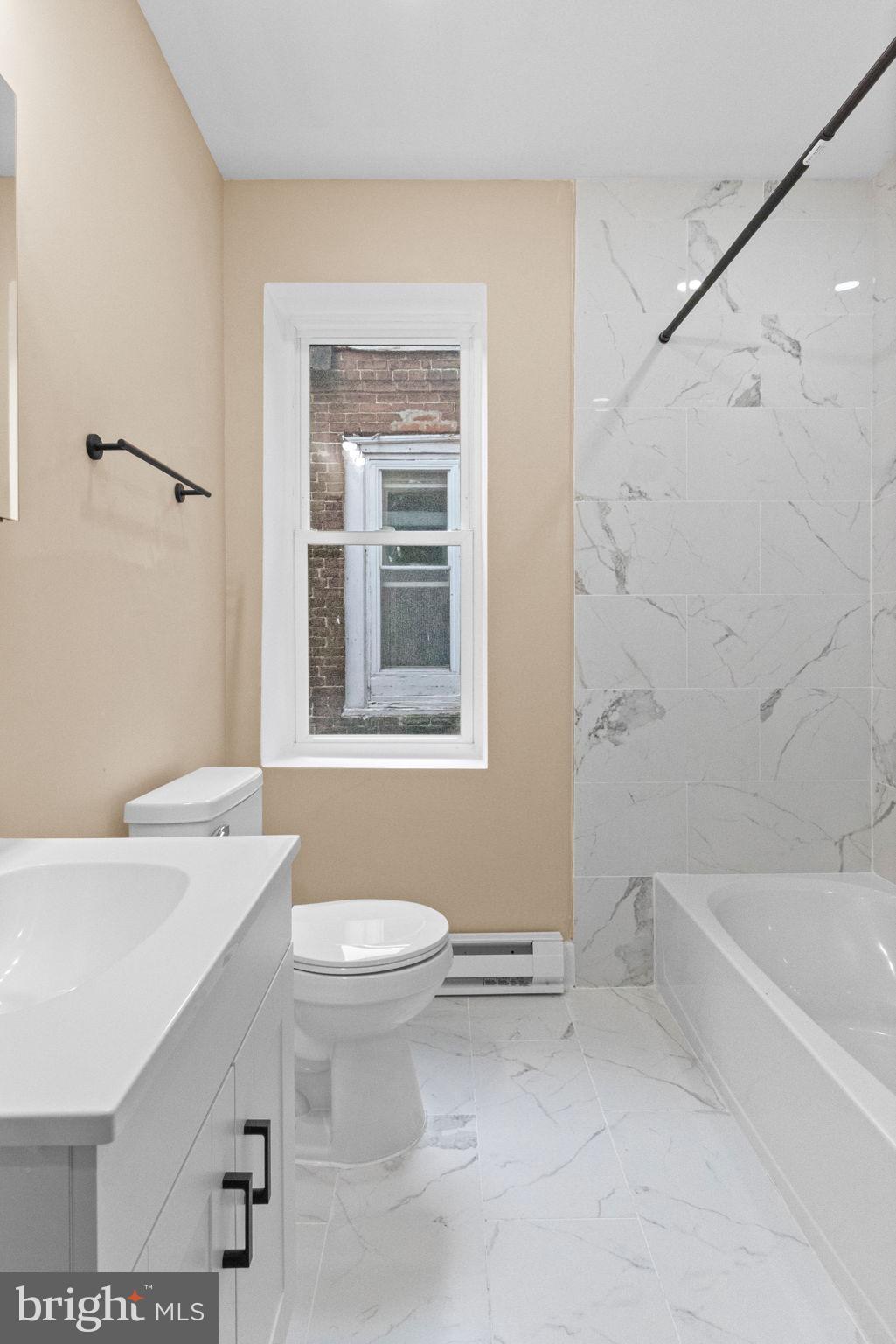 2839 North 9th Street, Unit 1 Philadelphia, PA 19133 - Photo 13 of 19 a bathroom with a sink a toilet and shower