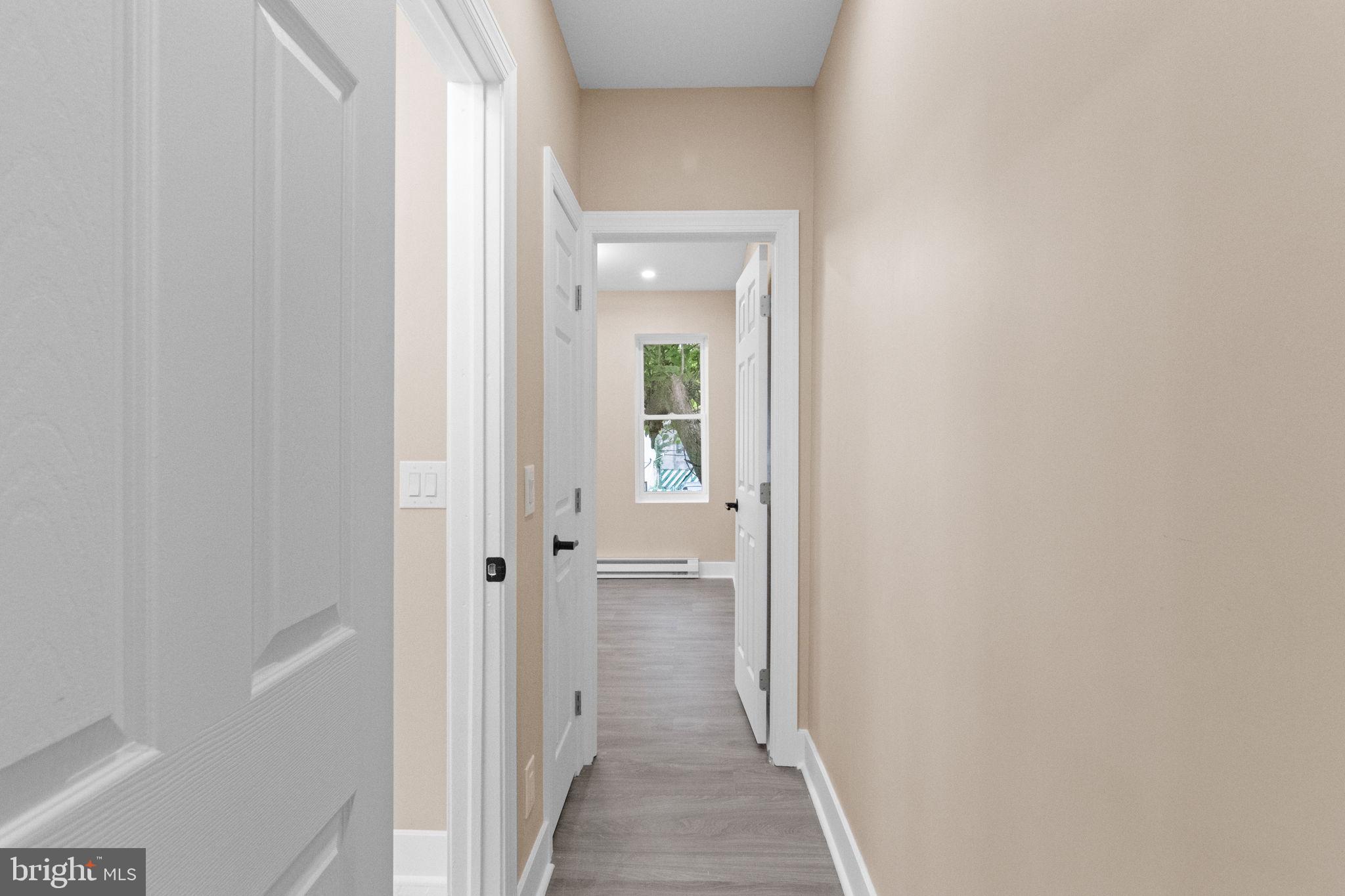2839 North 9th Street, Unit 1 Philadelphia, PA 19133 - Photo 14 of 19 a view of a hallway with wooden floor