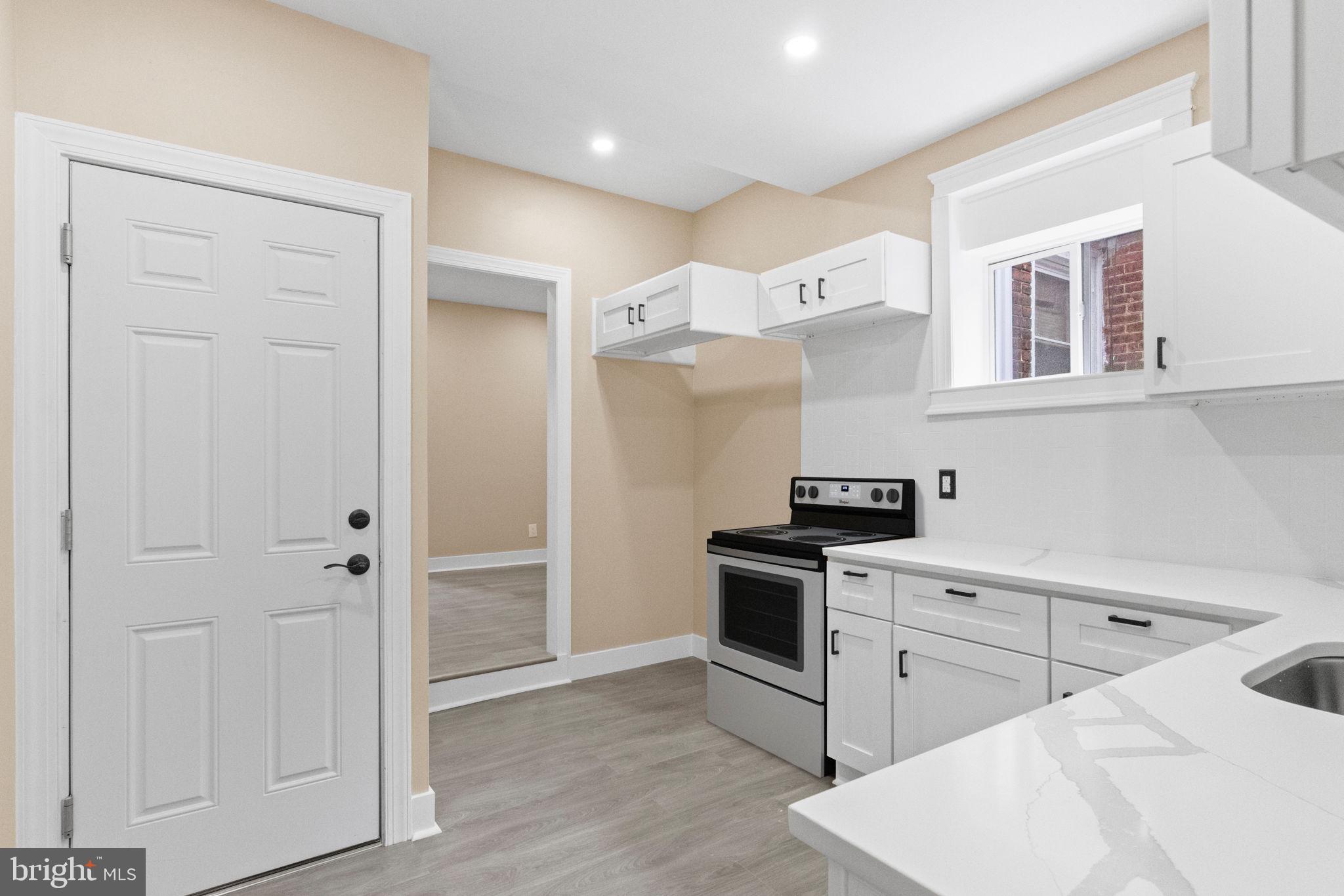 2839 North 9th Street, Unit 1 Philadelphia, PA 19133 - Photo 4 of 19 a kitchen with cabinets and stainless steel appliances