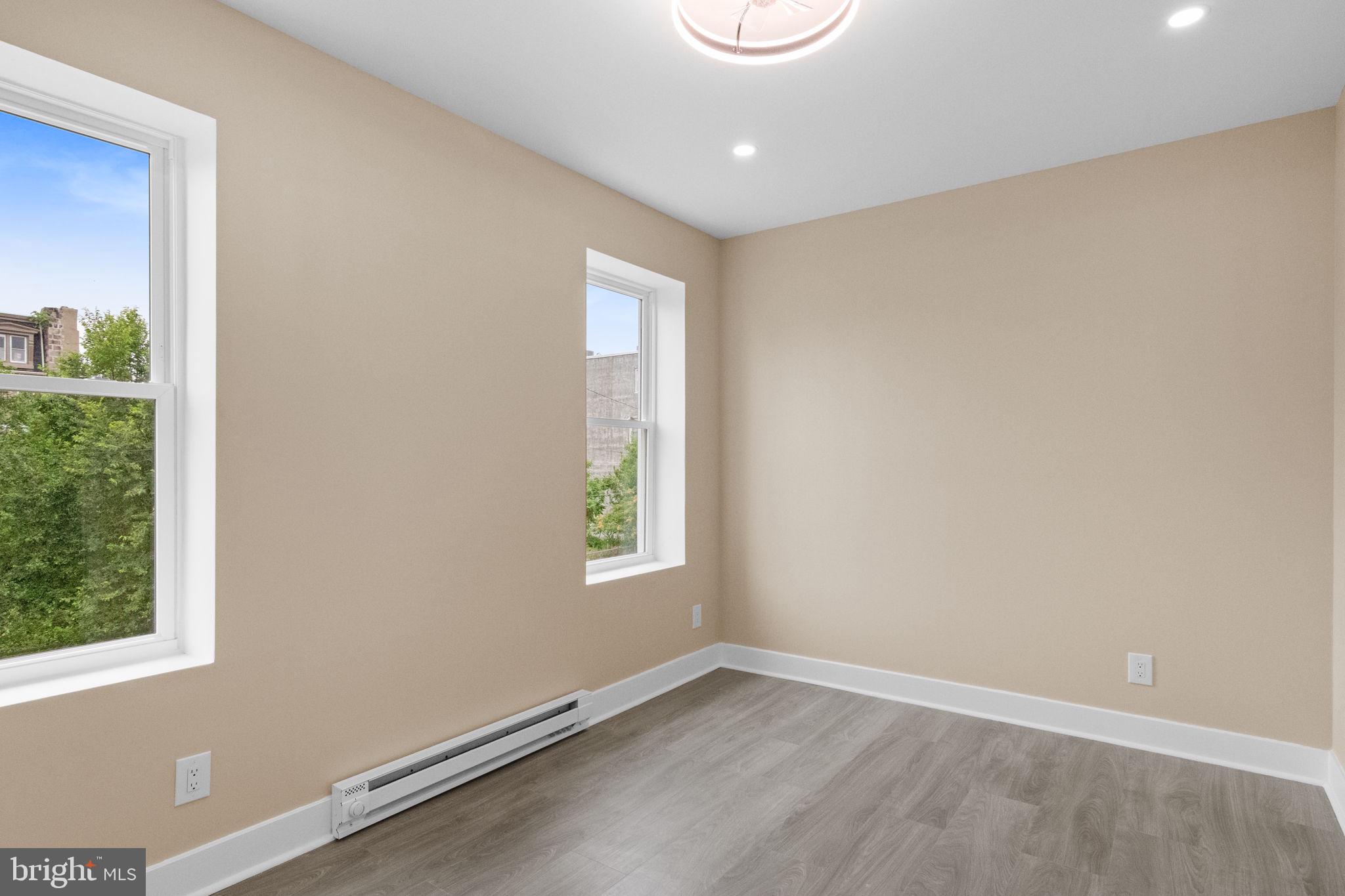 2839 North 9th Street, Unit 1 Philadelphia, PA 19133 - Photo 8 of 19 an empty room with windows