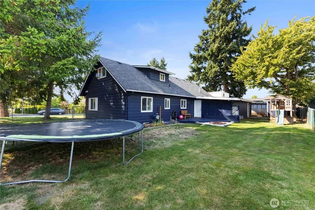 an aerial view of a house with a yard and garden
