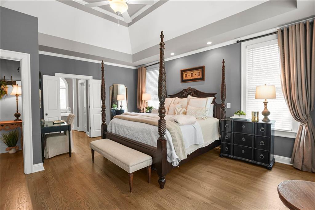 509 Crested Hawk Ridge Canton, GA 30114 - Photo 28 of 89 a bedroom with a bed and wooden floor