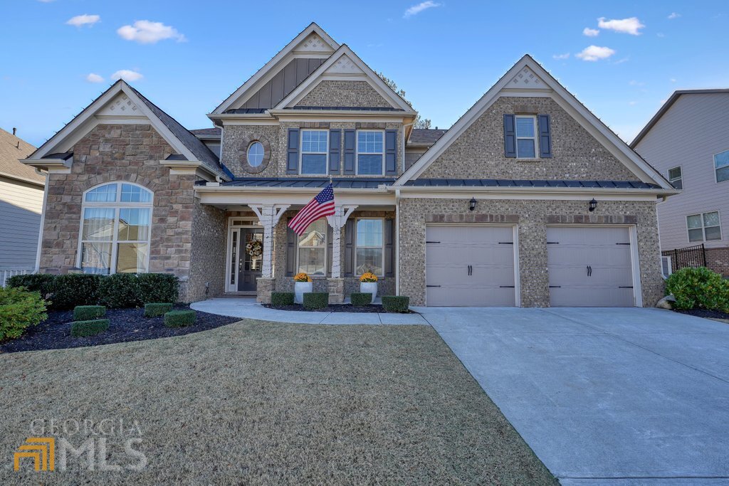 front view of a house with a yard