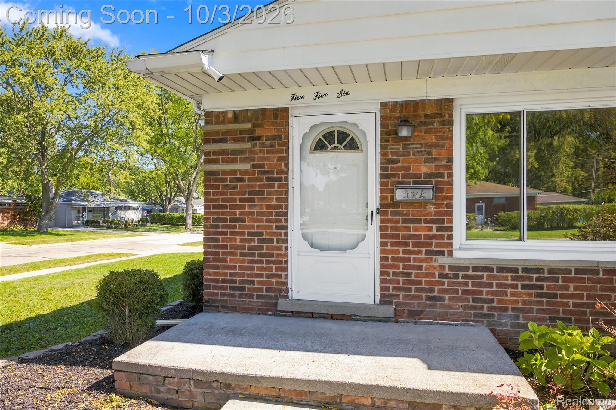 556 Henry Ruff Road Garden City, MI 48135 - Photo 28 of 49 Brick exterior with white trim, concrete porch, and established landscaping
