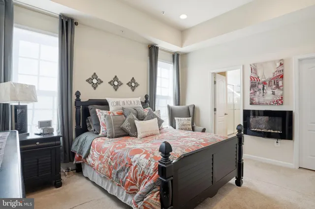 a bedroom with a bed and a couch