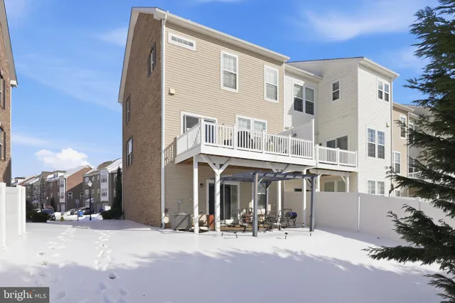 a front view of a building with yard and seating space