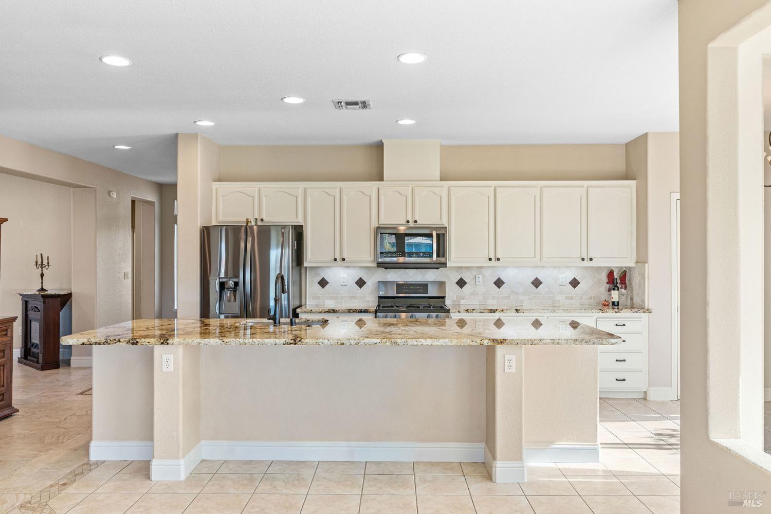 351 Spyglass Drive Rio Vista, CA 94571 - Photo 12 of 63 a kitchen with stainless steel appliances sink refrigerator and microwave