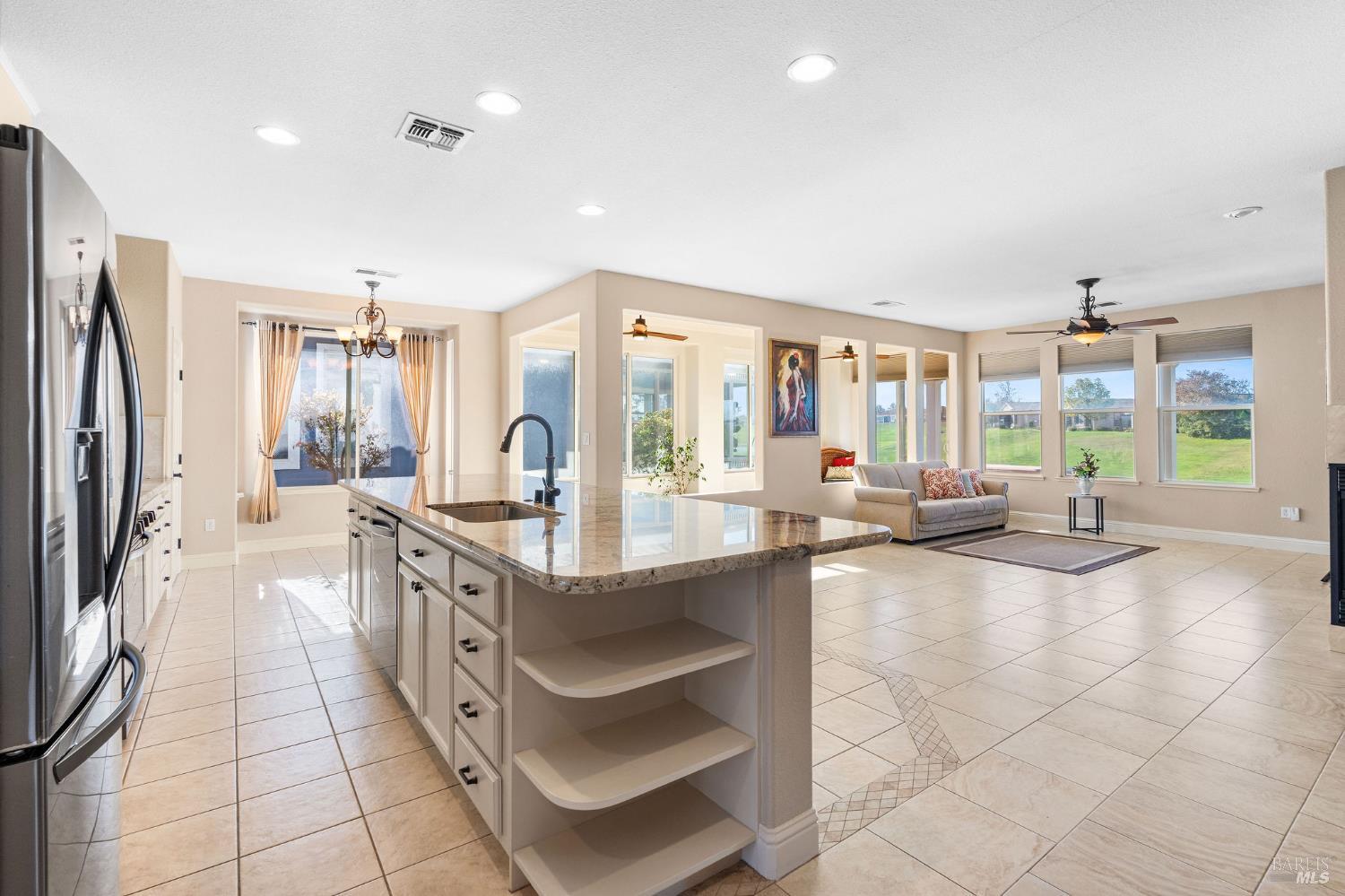 351 Spyglass Drive Rio Vista, CA 94571 - Photo 9 of 63 a large kitchen with kitchen island granite countertop a large counter top and appliances