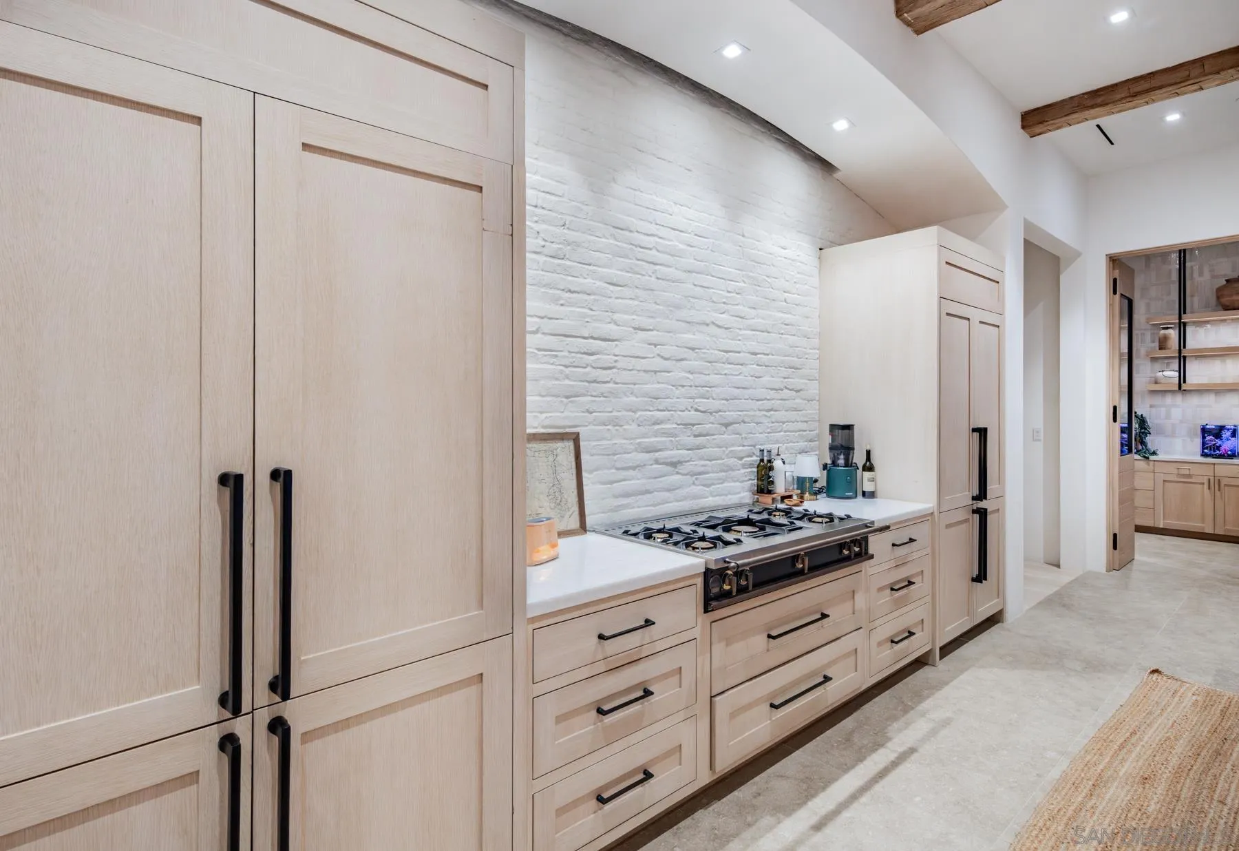 14783 Roxbury Terrace Rancho Santa Fe, CA 92067 - Photo 13 of 64 a kitchen with cabinets and a stove
