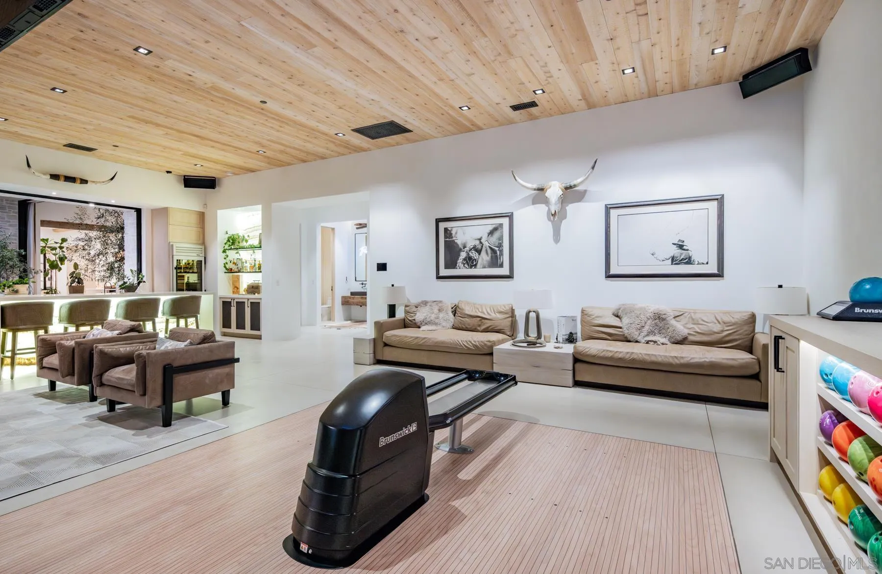 14783 Roxbury Terrace Rancho Santa Fe, CA 92067 - Photo 20 of 64 a living room with furniture or couch and a bookshelf