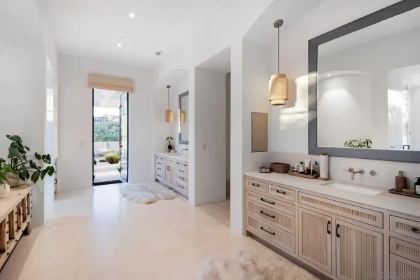 a bathroom with a sink and wooden floor