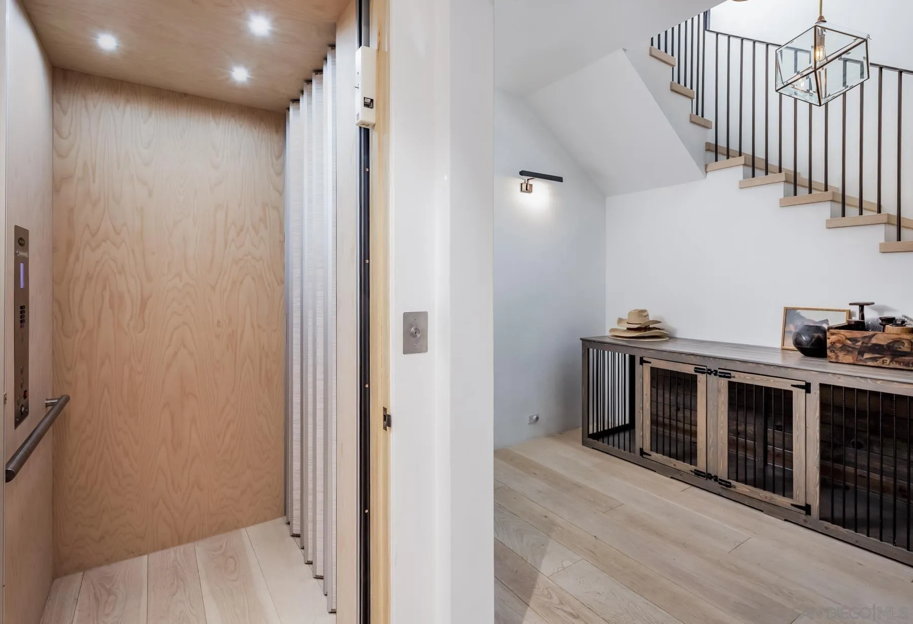 14783 Roxbury Terrace Rancho Santa Fe, CA 92067 - Photo 35 of 64 a view of a hallway with kitchen and stainless steel appliances