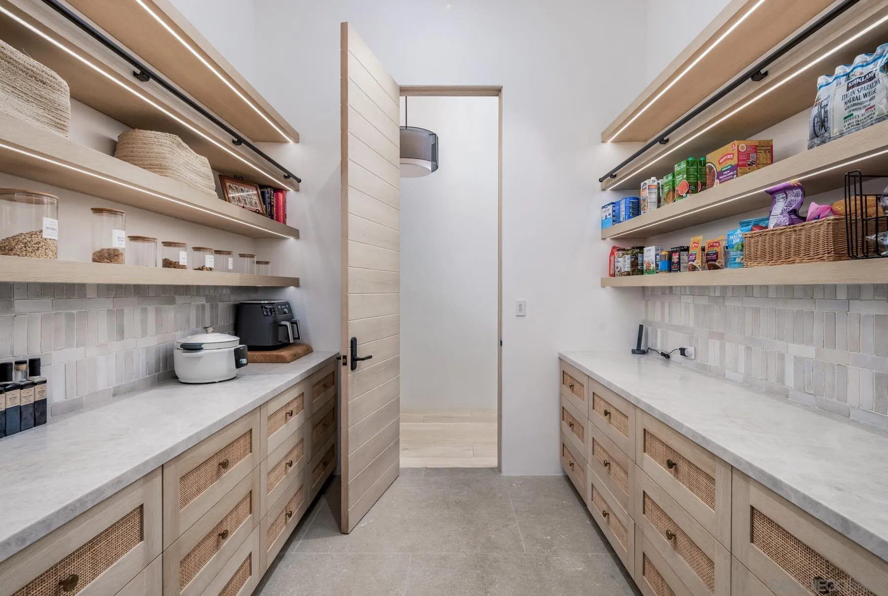 14783 Roxbury Terrace Rancho Santa Fe, CA 92067 - Photo 36 of 64 a kitchen with stainless steel appliances granite countertop a lot of cabinets and wooden floor