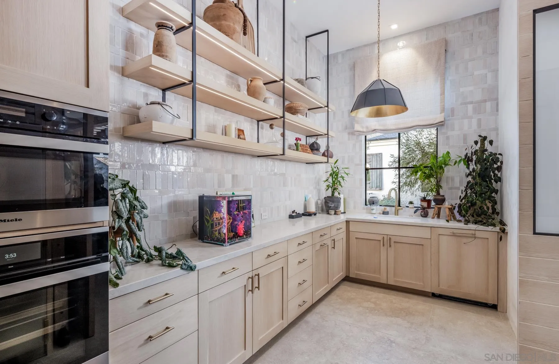 14783 Roxbury Terrace Rancho Santa Fe, CA 92067 - Photo 37 of 64 a kitchen with stainless steel appliances kitchen island granite countertop a sink and cabinets