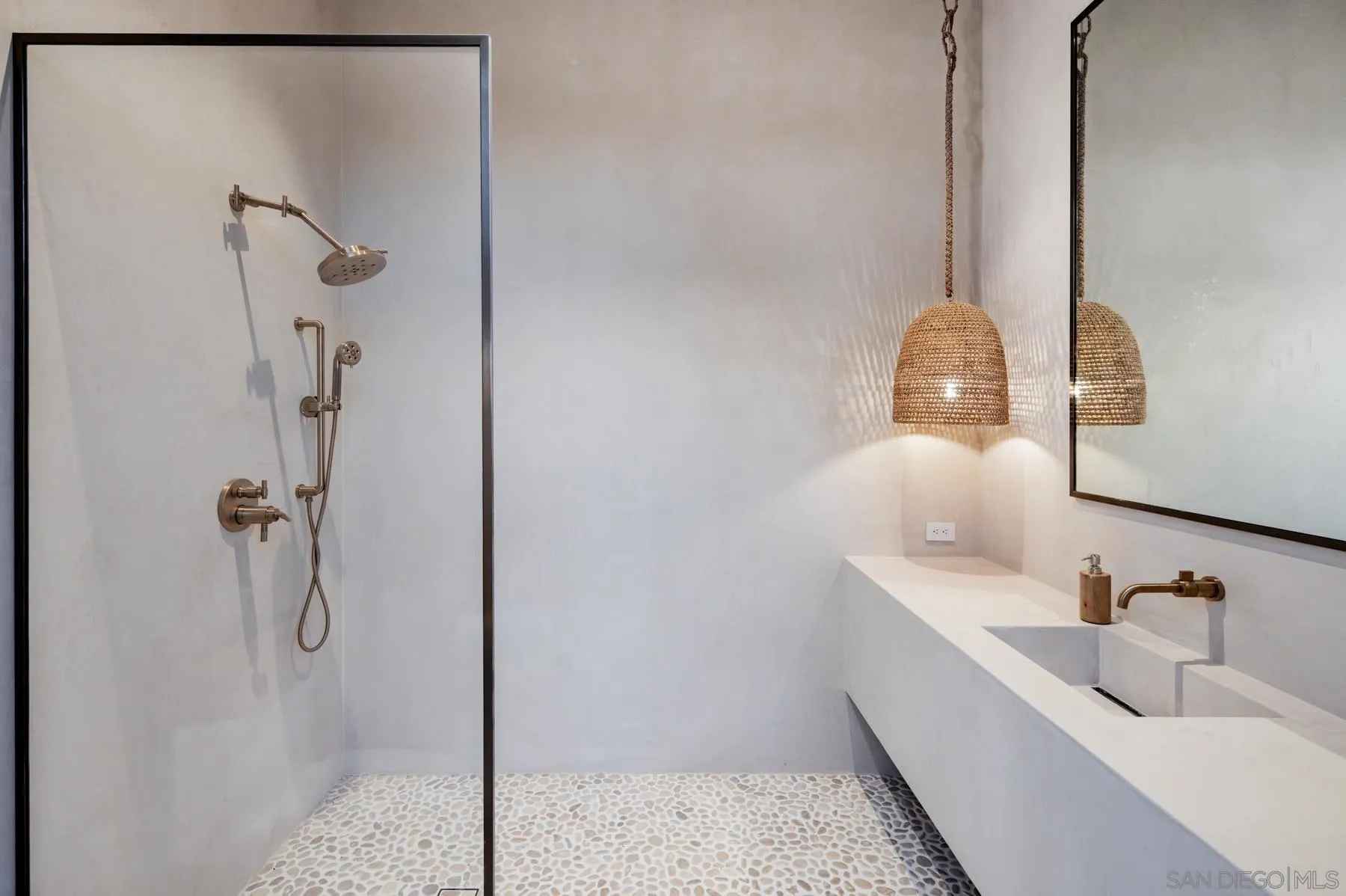 14783 Roxbury Terrace Rancho Santa Fe, CA 92067 - Photo 44 of 64 a bathroom with a sink and a mirror