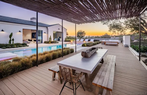 a view of a swimming pool with an outdoor seating