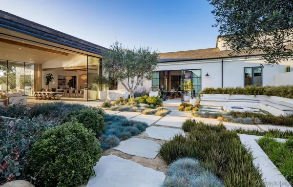 a outdoor living space with furniture and a fireplace