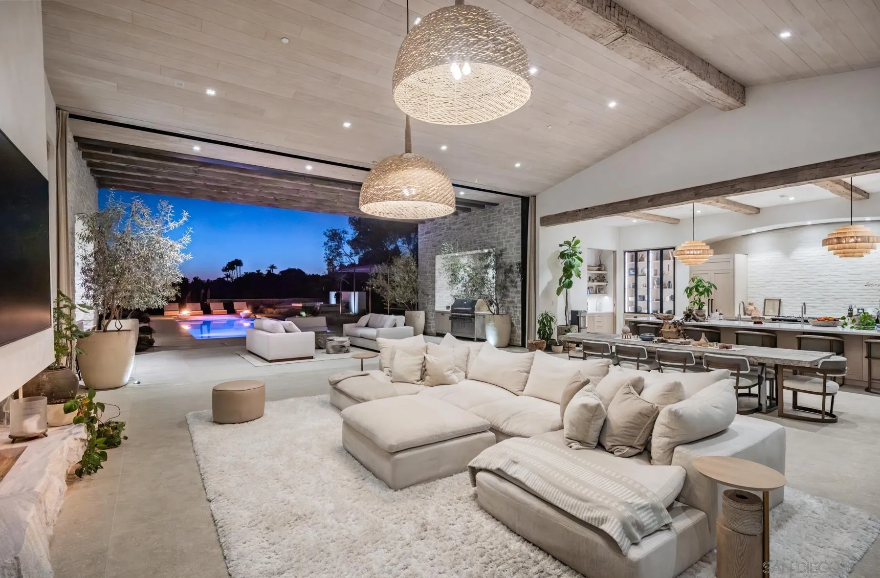 14783 Roxbury Terrace Rancho Santa Fe, CA 92067 - Photo 62 of 64 a living room with furniture a chandelier and a large mirror