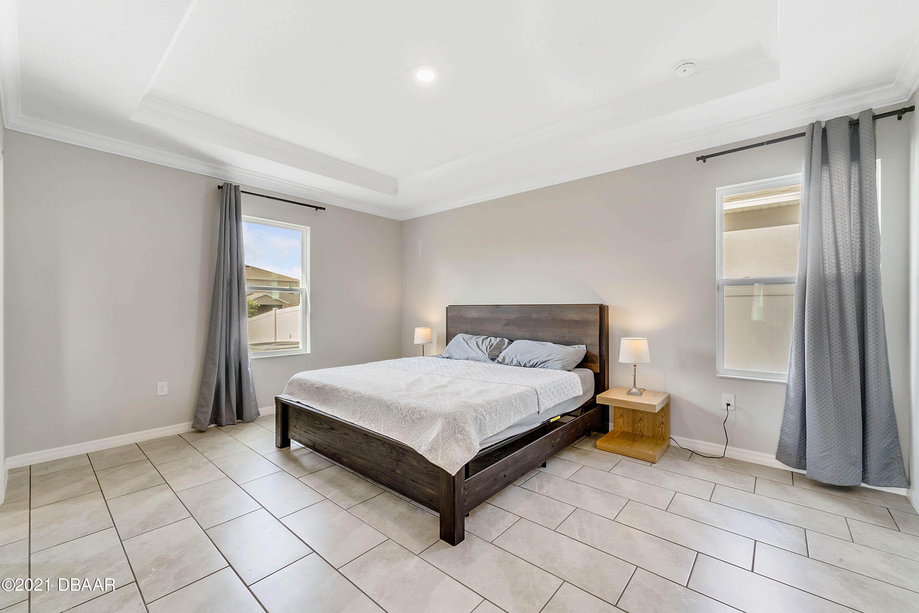 235 Jackson Loop DeLand, FL 32724 - Photo 13 of 27 a bedroom with a bed and a window