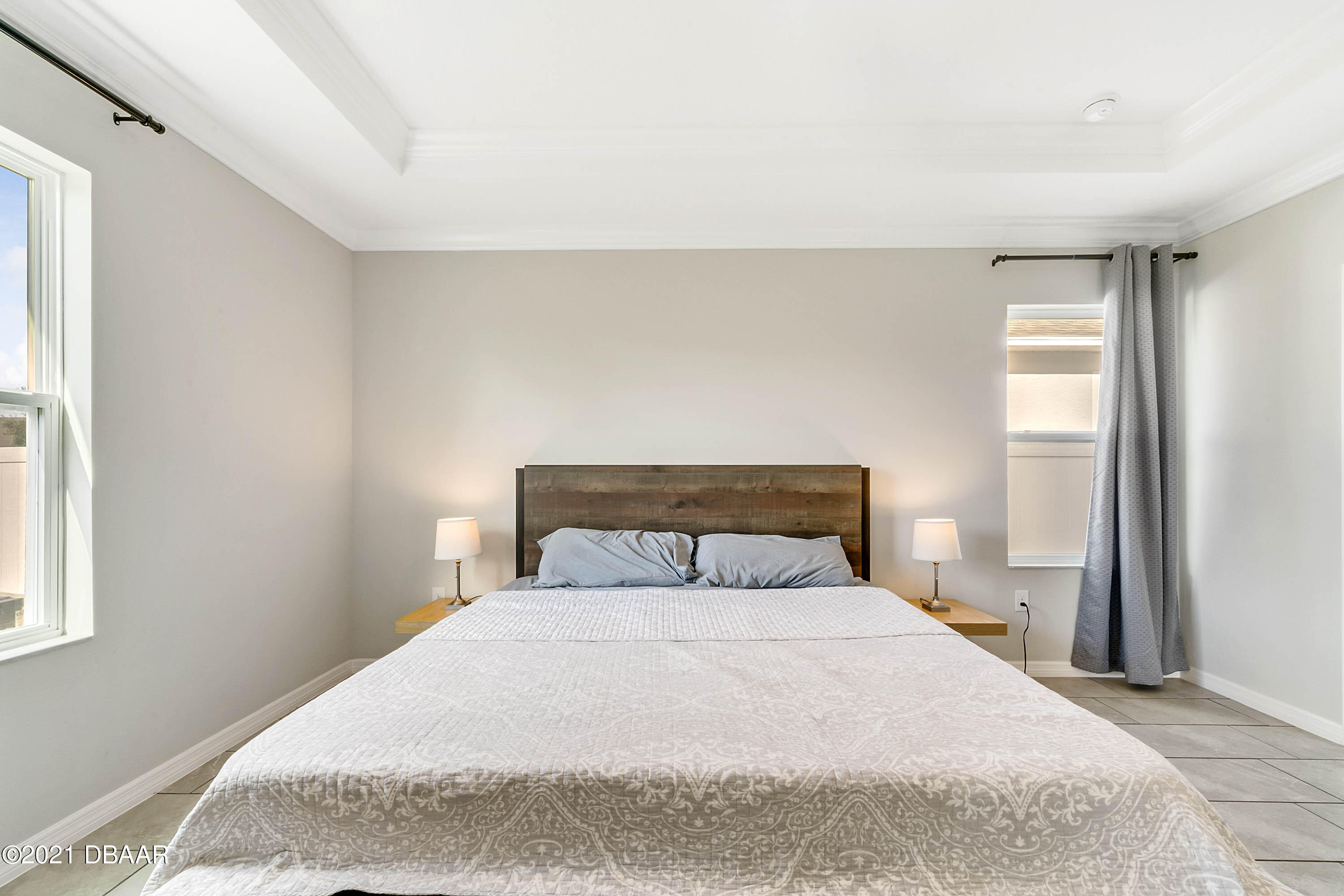 235 Jackson Loop DeLand, FL 32724 - Photo 14 of 27 a bedroom with a bed and a window