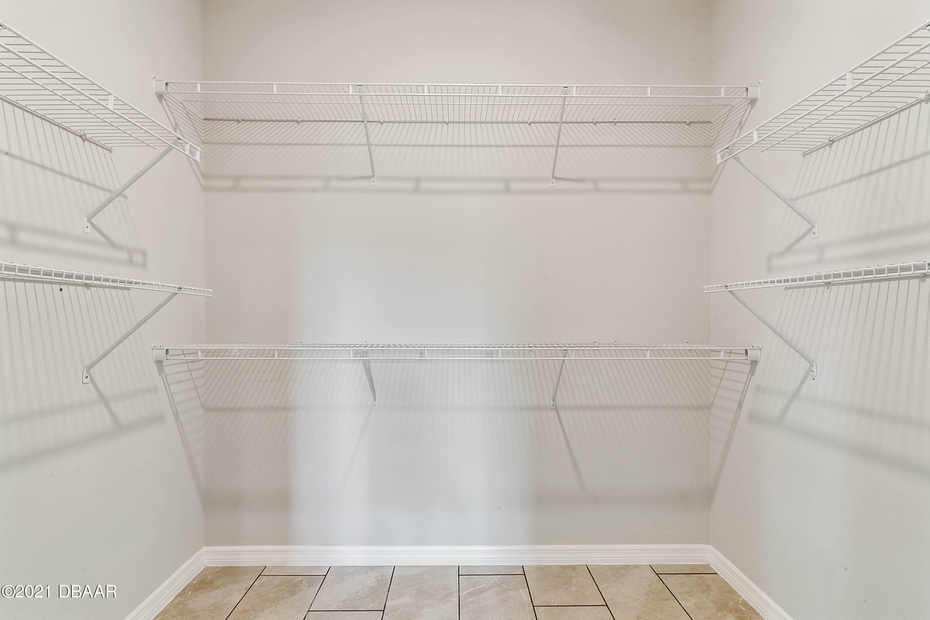 235 Jackson Loop DeLand, FL 32724 - Photo 16 of 27 a view of small space with racks on the wall