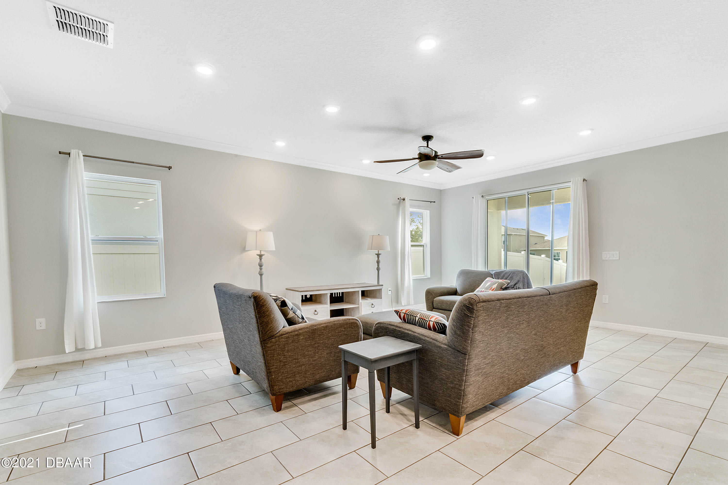 235 Jackson Loop DeLand, FL 32724 - Photo 6 of 27 a living room with furniture and a table