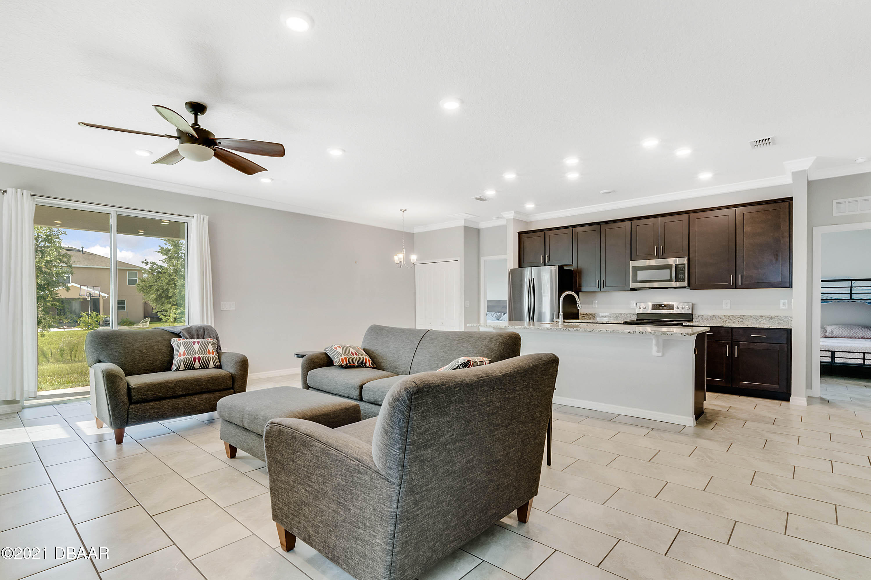 235 Jackson Loop DeLand, FL 32724 - Photo 7 of 27 a living room with furniture and kitchen view