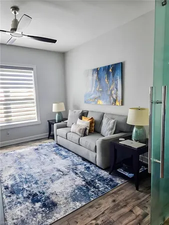 a living room with furniture and a window