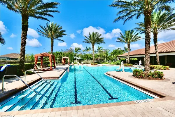 a view of a backyard with swimming pool