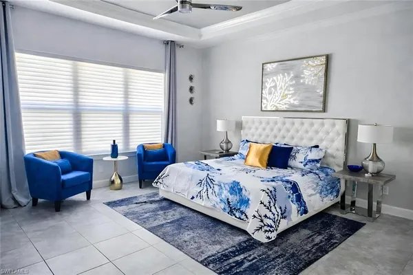 a bedroom with a bed and a couch