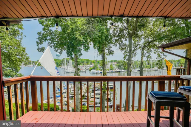a view of a wooden bench in a backyard