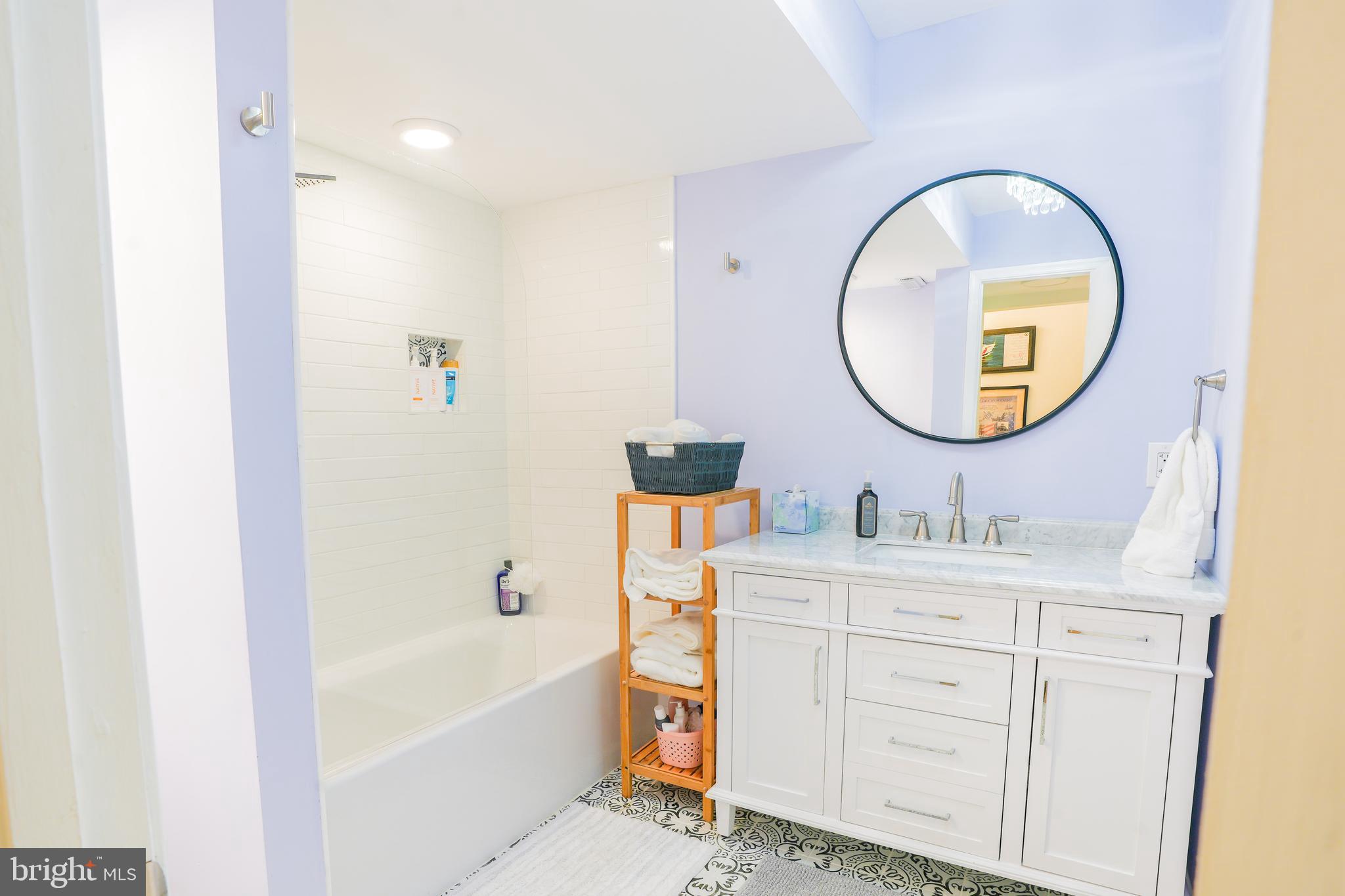 780 F Fairview Avenue, Unit F Annapolis, MD 21403 - Photo 14 of 28 a bathroom with a sink and a mirror