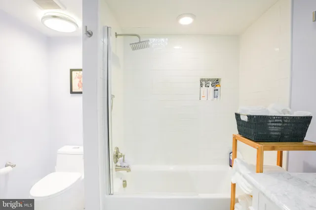 a bathroom with a bathtub and a toilet