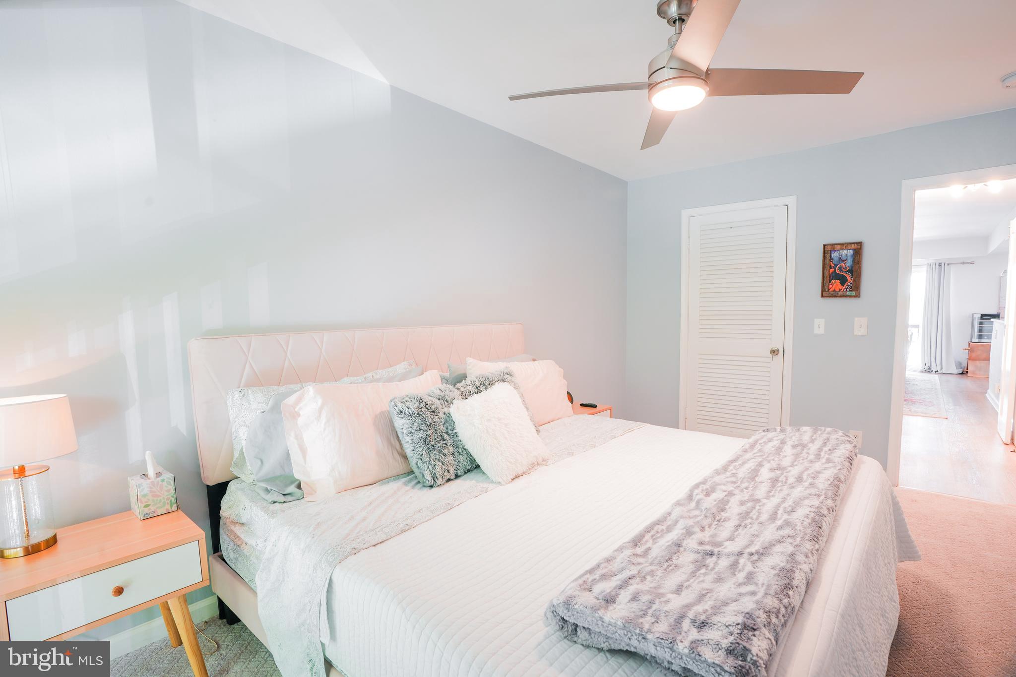 780 F Fairview Avenue, Unit F Annapolis, MD 21403 - Photo 18 of 28 a bedroom with a bed and a chandelier