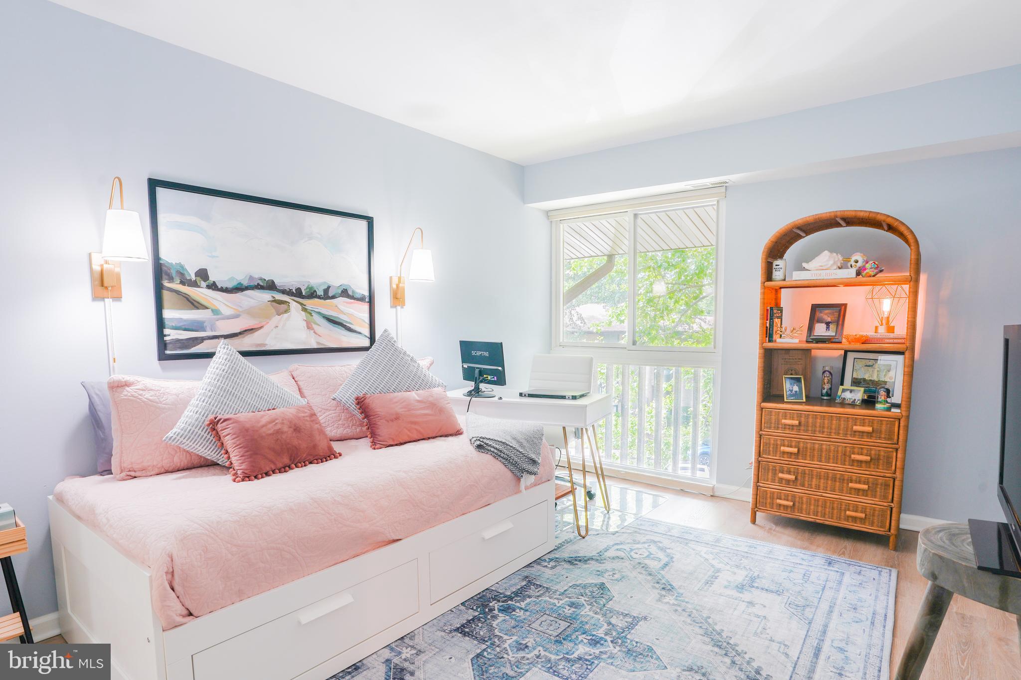 780 F Fairview Avenue, Unit F Annapolis, MD 21403 - Photo 19 of 28 a bedroom with a bed and a painting on the wall