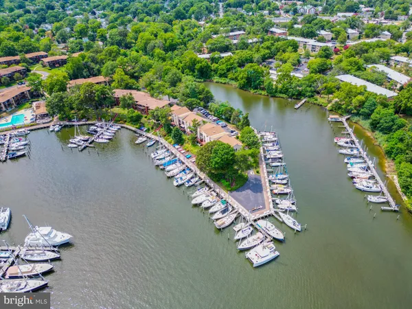 an aerial view of a house a yard and lake view