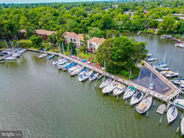 an aerial view of a house with outdoor space and lake view
